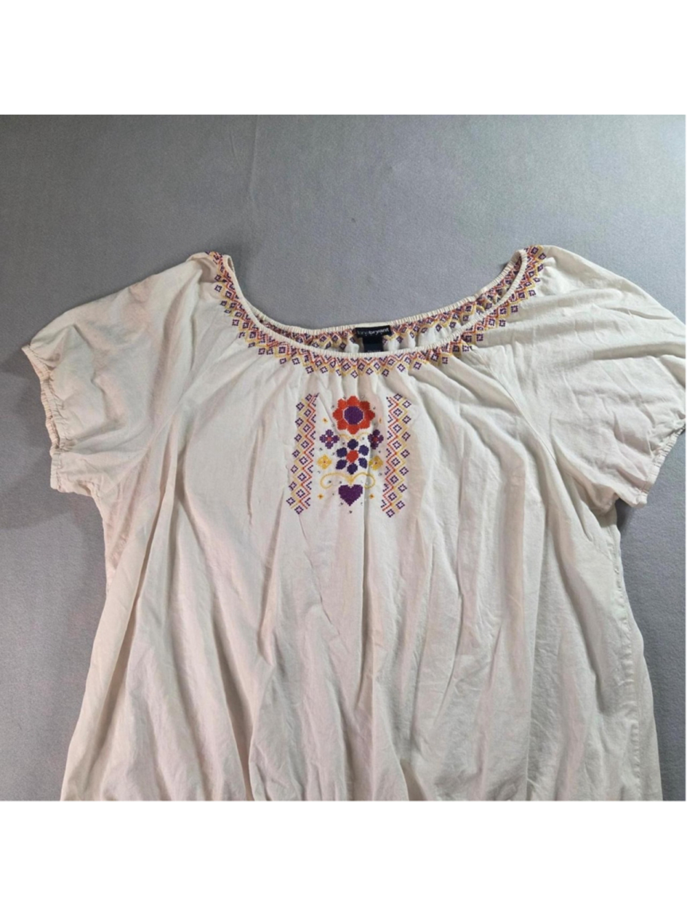 Lane Bryant cream cotton blouse with embroidered floral and geometric design, si